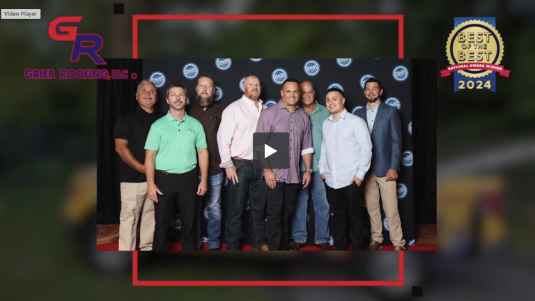 Group of Grier Roofing team members posing at an awards ceremony, showcasing their recognition as a "Best of the Best" national award winner for 2024, emphasizing their commitment to quality roofing services.