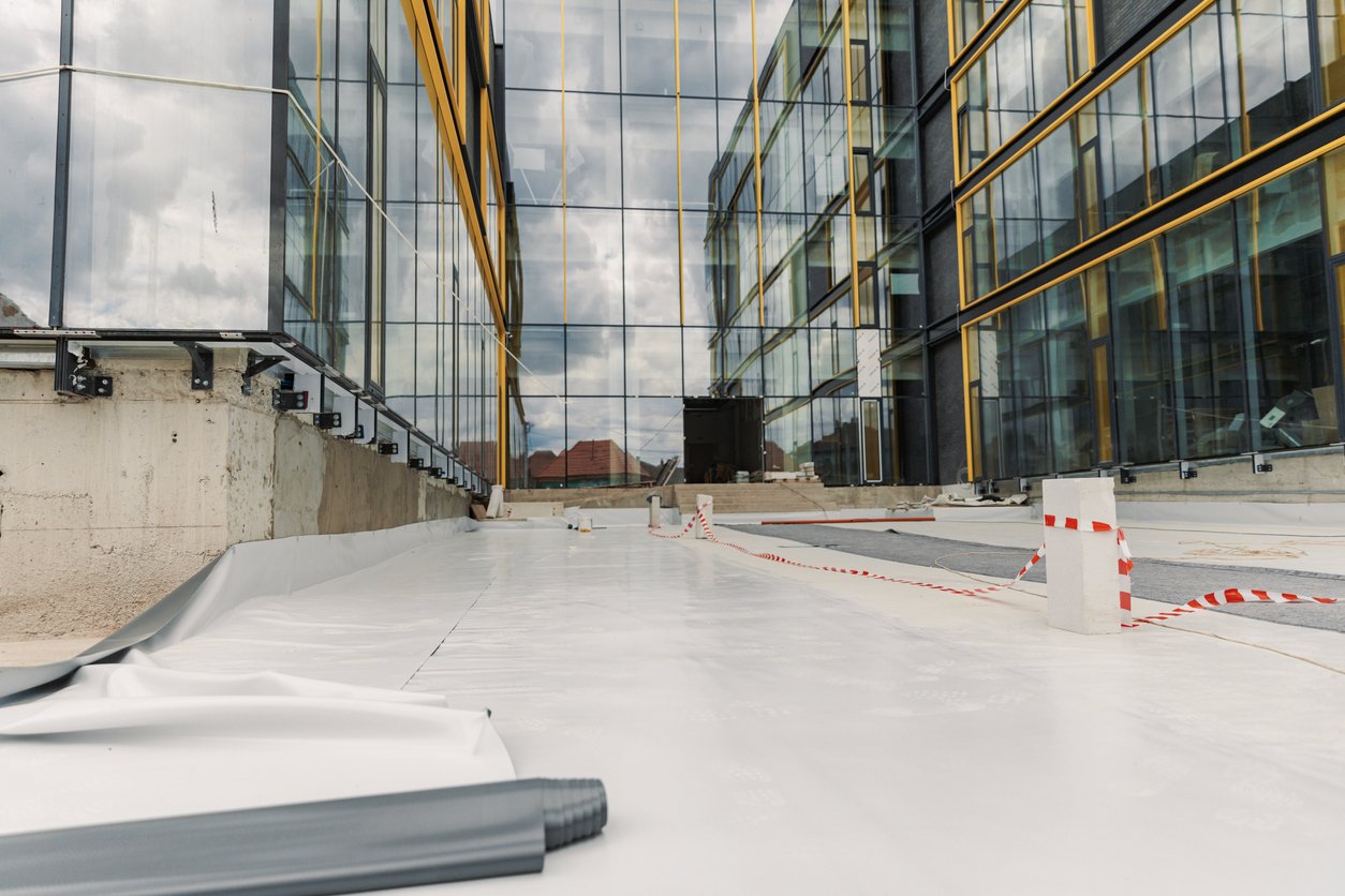 PVC Membrane, White flat commercial roof top | Grier Roofing